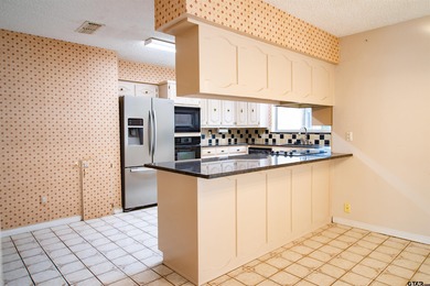 Lakefront classic! Brick ranch style home is ready for on Holly Lake Ranch Golf Club in Texas - for sale on GolfHomes.com, golf home, golf lot