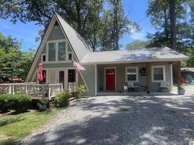 RESORT LIVING at its finest in this refreshing boat house style for sale on GolfHomes.com