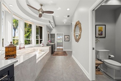 This custom contemporary classic is a truly remarkable offering on Fiddlesticks Country Club in Florida - for sale on GolfHomes.com, golf home, golf lot