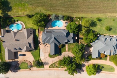 Take up this beautiful home located on the west side of Oak Tree on Oak Tree National Golf and Country Club in Oklahoma - for sale on GolfHomes.com, golf home, golf lot