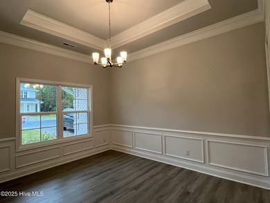 Ready Now! This beautiful new home in Palmetto Creek has a pond on Lennon Hills Golf Course in North Carolina - for sale on GolfHomes.com, golf home, golf lot