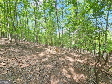 Nestled within the serene and exclusive Big Canoe community in on Big Canoe Golf Club - Cherokee in Georgia - for sale on GolfHomes.com, golf home, golf lot
