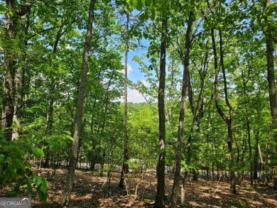 Nestled within the serene and exclusive Big Canoe community in on Big Canoe Golf Club - Cherokee in Georgia - for sale on GolfHomes.com, golf home, golf lot