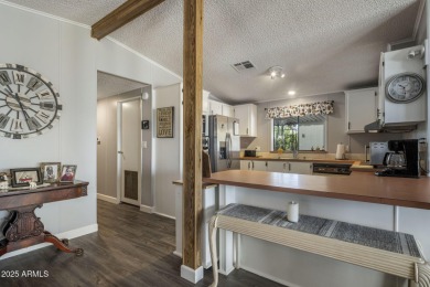 Enjoy the best of Arizona living in this updated 2-bedroom on Fountain of the Sun Country Club in Arizona - for sale on GolfHomes.com, golf home, golf lot