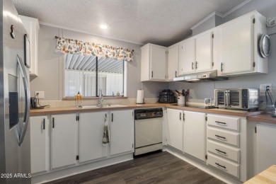 Enjoy the best of Arizona living in this updated 2-bedroom on Fountain of the Sun Country Club in Arizona - for sale on GolfHomes.com, golf home, golf lot