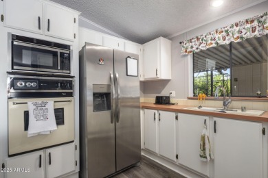 Enjoy the best of Arizona living in this updated 2-bedroom on Fountain of the Sun Country Club in Arizona - for sale on GolfHomes.com, golf home, golf lot