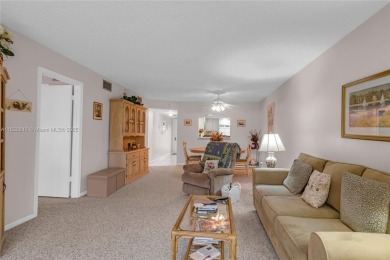 Beautiful 2 bed 2 bath unit in The Palms of Deer Creek located on Deer Creek Golf Club in Florida - for sale on GolfHomes.com, golf home, golf lot