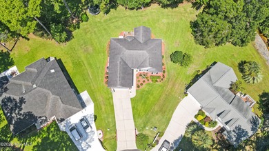 EXCEPTIONAL IS THE WORD! This pristine home is tucked away on a on Carolina Shores Golf Course in North Carolina - for sale on GolfHomes.com, golf home, golf lot