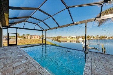 Fall in love with this 2015 built custom waterfront pool home on Saint Andrews South Golf Club in Florida - for sale on GolfHomes.com, golf home, golf lot