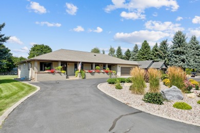 Park in the circular drive and enter this lovely home just on Polson Bay Golf Course - Championship Course in Montana - for sale on GolfHomes.com, golf home, golf lot