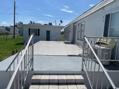 DISCOVER MOBILE GARDENS! Waterfront community with two boat on Oyster Creek Golf Club in Florida - for sale on GolfHomes.com, golf home, golf lot