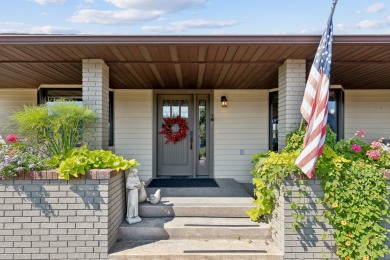 Park in the circular drive and enter this lovely home just on Polson Bay Golf Course - Championship Course in Montana - for sale on GolfHomes.com, golf home, golf lot