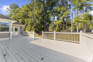 Set along the 10th fairway of the Santee National Golf Club on Santee National Golf Course in South Carolina - for sale on GolfHomes.com, golf home, golf lot