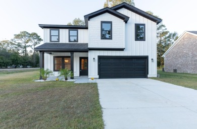 Welcome home to this 6 bedroom 4.5 bath custom new build in the on Berkeley Country Club in South Carolina - for sale on GolfHomes.com, golf home, golf lot