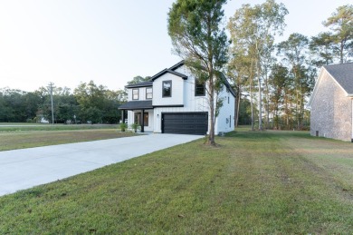 Welcome home to this 6 bedroom 4.5 bath custom new build in the on Berkeley Country Club in South Carolina - for sale on GolfHomes.com, golf home, golf lot