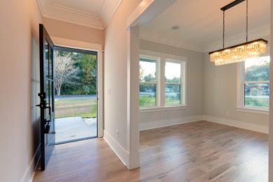 Welcome home to this 6 bedroom 4.5 bath custom new build in the on Berkeley Country Club in South Carolina - for sale on GolfHomes.com, golf home, golf lot