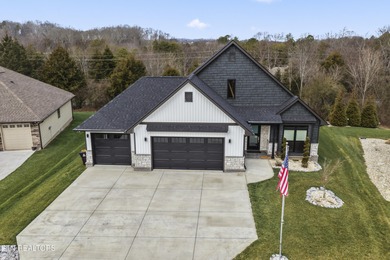 Emitting quality, comfort, and warmth, this pristine home makes on Tellico Village Golf Club in Tennessee - for sale on GolfHomes.com, golf home, golf lot