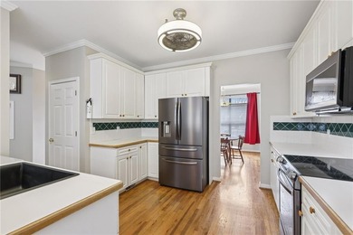 Nestled on a rare, just-under-an-acre lot at the end of a quiet on Collins Hill Golf Club in Georgia - for sale on GolfHomes.com, golf home, golf lot