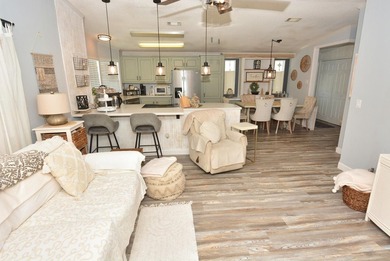 LAND OWNED-NO LAND LEASE This beautifully updated home is on Savanna Golf Club in Florida - for sale on GolfHomes.com, golf home, golf lot