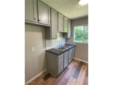 Charming and move-in ready, this 3-bedroom, 1-bath ranch in West on J. Edward Good Park Golf Course in Ohio - for sale on GolfHomes.com, golf home, golf lot