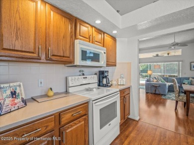 Beautifully updated 1990 Palmwood Bermuda  pool home. This on Glen Lakes Country Club in Florida - for sale on GolfHomes.com, golf home, golf lot