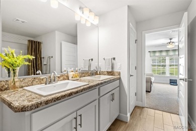 Scenically situated along the 10th hole tee of the highly on Twisted Oaks Golf Club in Florida - for sale on GolfHomes.com, golf home, golf lot