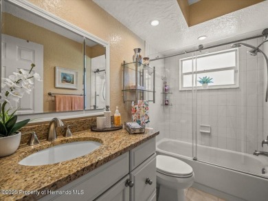 Beautifully updated 1990 Palmwood Bermuda  pool home. This on Glen Lakes Country Club in Florida - for sale on GolfHomes.com, golf home, golf lot