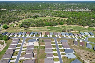 Scenically situated along the 10th hole tee of the highly on Twisted Oaks Golf Club in Florida - for sale on GolfHomes.com, golf home, golf lot