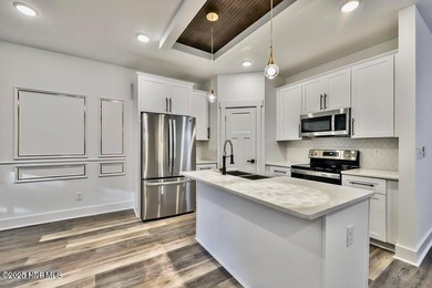 Discover a home that flawlessly blends modern sophistication on Carolina Shores Golf Course in North Carolina - for sale on GolfHomes.com, golf home, golf lot