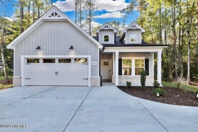 Discover a home that flawlessly blends modern sophistication on Carolina Shores Golf Course in North Carolina - for sale on GolfHomes.com, golf home, golf lot