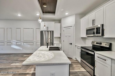 Discover a home that flawlessly blends modern sophistication on Carolina Shores Golf Course in North Carolina - for sale on GolfHomes.com, golf home, golf lot