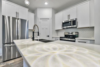 Discover a home that flawlessly blends modern sophistication on Carolina Shores Golf Course in North Carolina - for sale on GolfHomes.com, golf home, golf lot