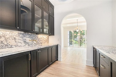 Set on a sprawling 1-acre lot in an established, tree-lined on Dunwoody Country Club in Georgia - for sale on GolfHomes.com, golf home, golf lot