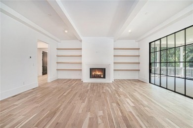 Set on a sprawling 1-acre lot in an established, tree-lined on Dunwoody Country Club in Georgia - for sale on GolfHomes.com, golf home, golf lot
