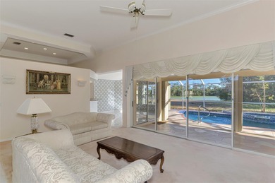 Don't miss out on this custom-built home with stunning pond and on Pinemoor West Golf Club in Florida - for sale on GolfHomes.com, golf home, golf lot