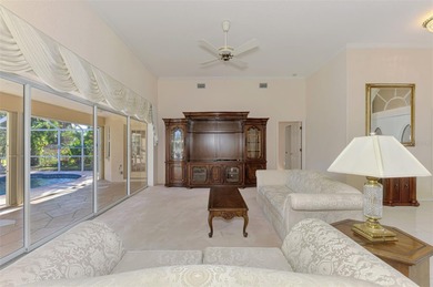 Don't miss out on this custom-built home with stunning pond and on Pinemoor West Golf Club in Florida - for sale on GolfHomes.com, golf home, golf lot