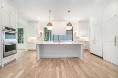 Set on a sprawling 1-acre lot in an established, tree-lined on Dunwoody Country Club in Georgia - for sale on GolfHomes.com, golf home, golf lot