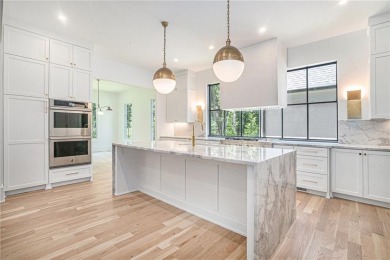 Set on a sprawling 1-acre lot in an established, tree-lined on Dunwoody Country Club in Georgia - for sale on GolfHomes.com, golf home, golf lot