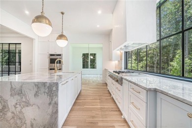 Set on a sprawling 1-acre lot in an established, tree-lined on Dunwoody Country Club in Georgia - for sale on GolfHomes.com, golf home, golf lot
