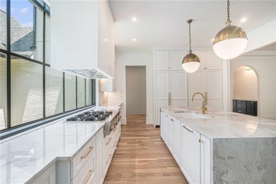 Set on a sprawling 1-acre lot in an established, tree-lined on Dunwoody Country Club in Georgia - for sale on GolfHomes.com, golf home, golf lot