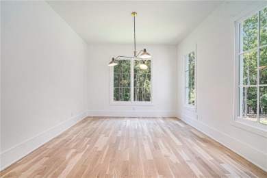 Set on a sprawling 1-acre lot in an established, tree-lined on Dunwoody Country Club in Georgia - for sale on GolfHomes.com, golf home, golf lot