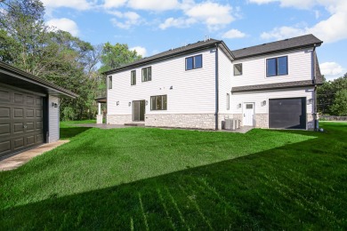 Enter into a world of contemporary elegance and comfort in this on Hickory Hills Country Club in Illinois - for sale on GolfHomes.com, golf home, golf lot