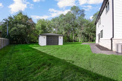 Enter into a world of contemporary elegance and comfort in this on Hickory Hills Country Club in Illinois - for sale on GolfHomes.com, golf home, golf lot