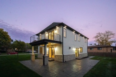 Enter into a world of contemporary elegance and comfort in this on Hickory Hills Country Club in Illinois - for sale on GolfHomes.com, golf home, golf lot