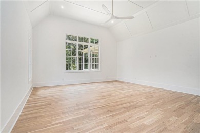 Set on a sprawling 1-acre lot in an established, tree-lined on Dunwoody Country Club in Georgia - for sale on GolfHomes.com, golf home, golf lot