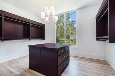 Set on a sprawling 1-acre lot in an established, tree-lined on Dunwoody Country Club in Georgia - for sale on GolfHomes.com, golf home, golf lot