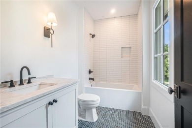 Set on a sprawling 1-acre lot in an established, tree-lined on Dunwoody Country Club in Georgia - for sale on GolfHomes.com, golf home, golf lot