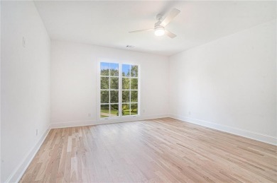 Set on a sprawling 1-acre lot in an established, tree-lined on Dunwoody Country Club in Georgia - for sale on GolfHomes.com, golf home, golf lot