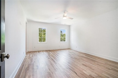 Set on a sprawling 1-acre lot in an established, tree-lined on Dunwoody Country Club in Georgia - for sale on GolfHomes.com, golf home, golf lot