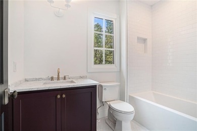 Set on a sprawling 1-acre lot in an established, tree-lined on Dunwoody Country Club in Georgia - for sale on GolfHomes.com, golf home, golf lot